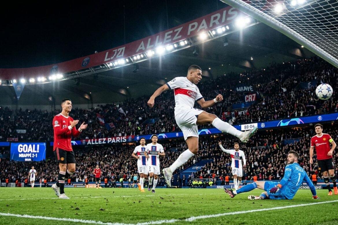 Football players celebrating goal in Champions League night match